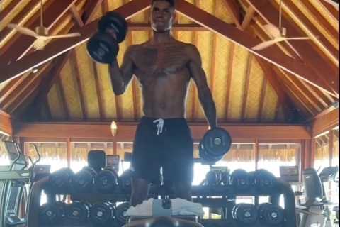 Marcus Rashford shows off ripped body as topless Man Utd star pumps iron in gym to bulk up for new season
