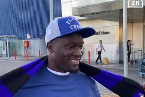 Chelsea flop Romelu Lukaku holds up Inter Milan scarf as striker lands in Italy to seal £6.9m season-long loan transfer