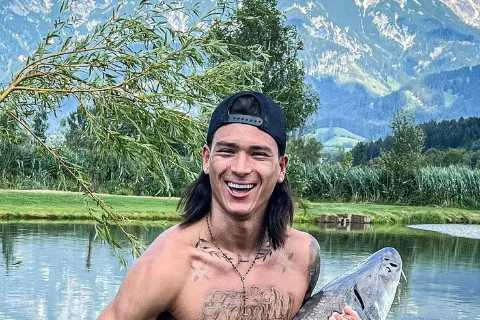 Topless Darwin Nunez shows off ‘absurd’ physique on fishing trip with Liverpool team-mates and celebrates HUGE catch
