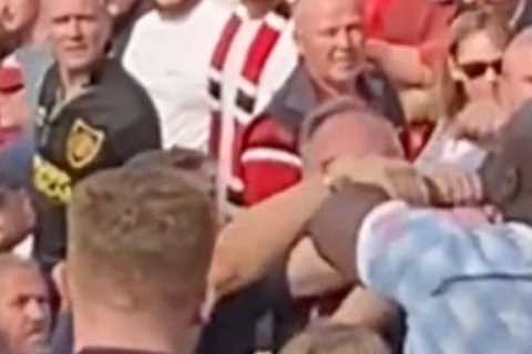 Watch shocking moment brawl erupts between Man Utd fans at Old Trafford during defeat to Brighton