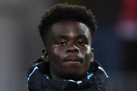 Fans all say the same thing as Bukayo Saka and Arsenal squad wear iconic Arsene Wenger coat for chilly Bodo/Glimt trip
