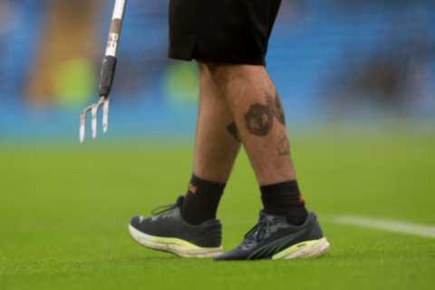 Man City groundsman shows off Man Utd tattoo on leg as he inspects pitch before Fulham clash