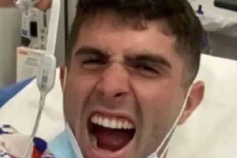 Chelsea star Christian Pulisic celebrates from his hospital bed as USA’s goal hero vows to be back for World Cup last-16