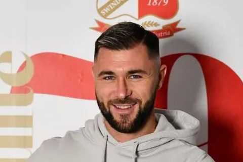 Charlie Austin, 33, completes free transfer to Swindon Town as he rejoins old club two weeks after Brisbane Roar release
