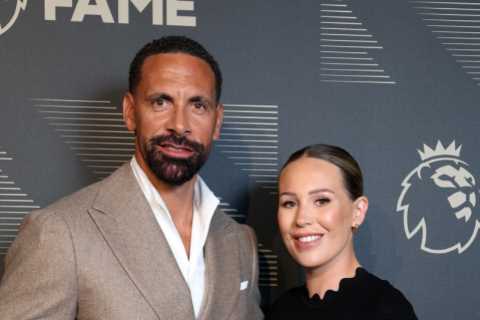 Rio Ferdinand kisses wife Kate as he cups her blossoming baby bump at his Premier League Hall of Fame induction