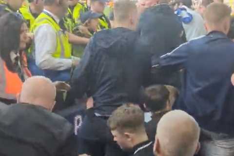 Shocking moment chaos erupts at Leeds United as fans clash with police following relegation from Premier League