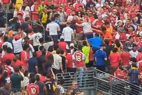 Watch fan get knocked out by rival supporter as crowd fight at heated Man Utd versus Arsenal ‘friendly’ in US