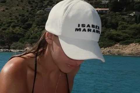 Handsome Premier League legend’s model daughter stuns in bikini as she enjoys holiday boat trip